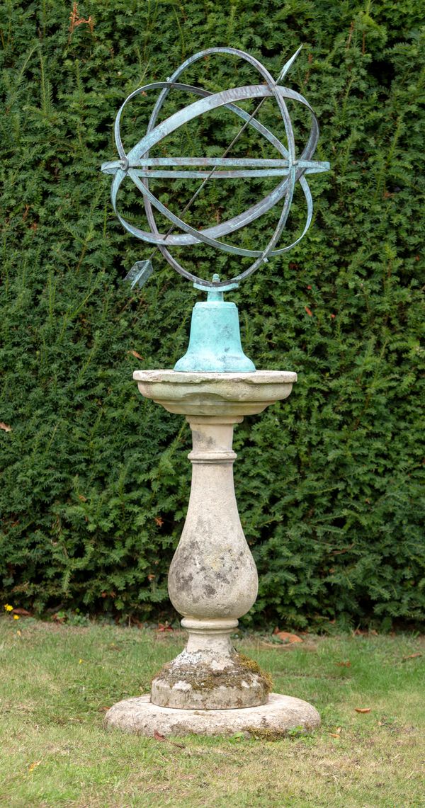 A carved Cotswold stone sundial pedestal 2nd half 19th century on cushion base and with later armillary 194cm high