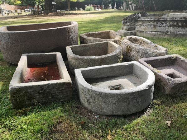 A collection of six troughs some with drainage holes the largest 75cm long