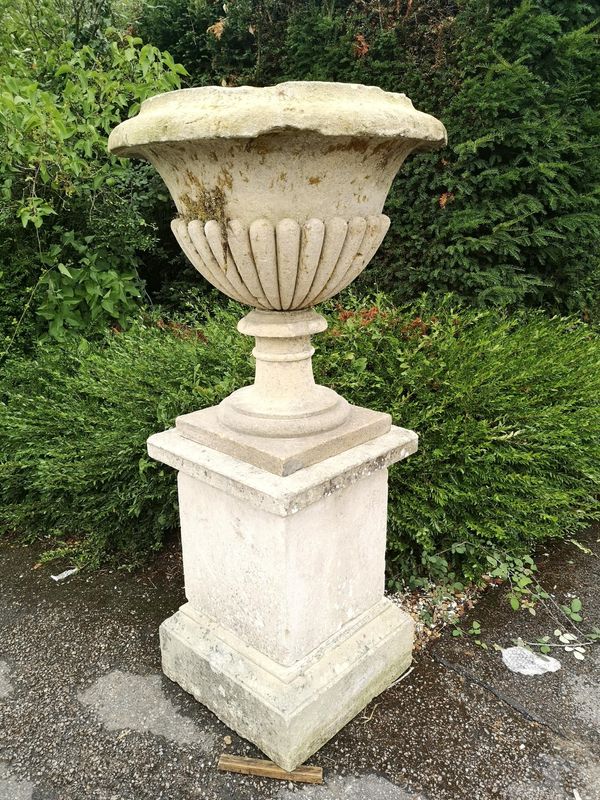A pair of substantial carved Cotswold stone urns 18th century 158cm high