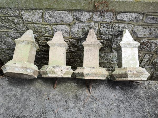 A set of four composition stone finials late 19th century 34cm high