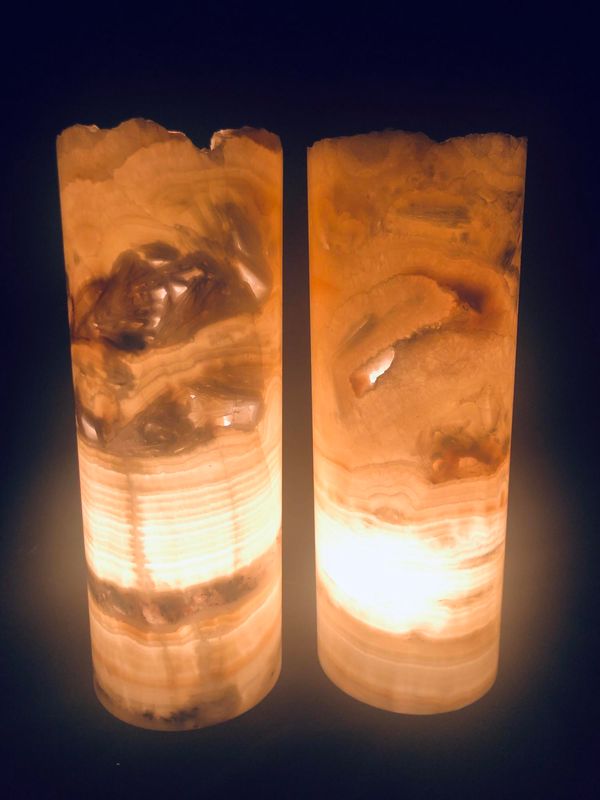 A pair of onyx cylinder lamps 30cm high