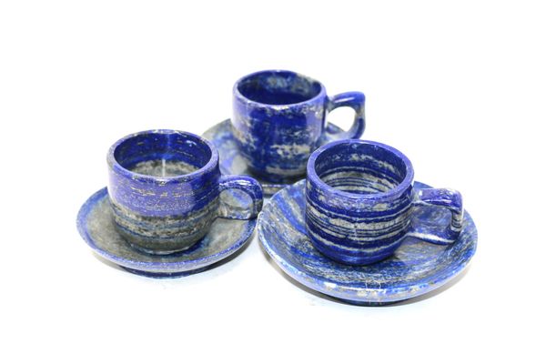 A set of three lapis lazuli cups saucers 10cm diameter, cups 5cm high by 6cm diameter, 905g