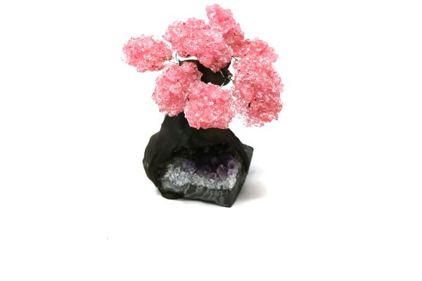 A rose quartz tree with nine petals on amethyst and composition base 14cm high