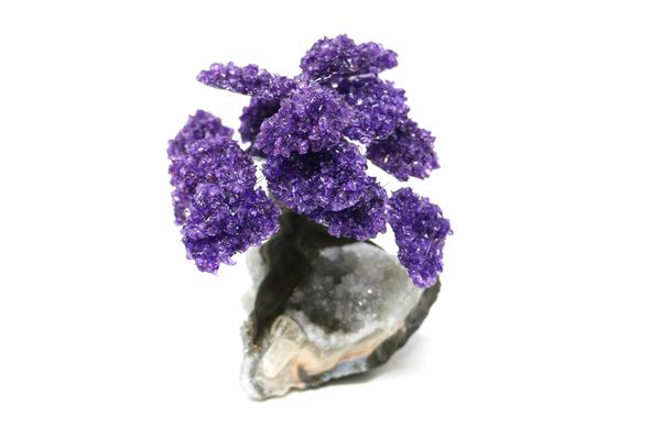 An amethyst tree with fifteen petals on composition and amethyst base 18cm high