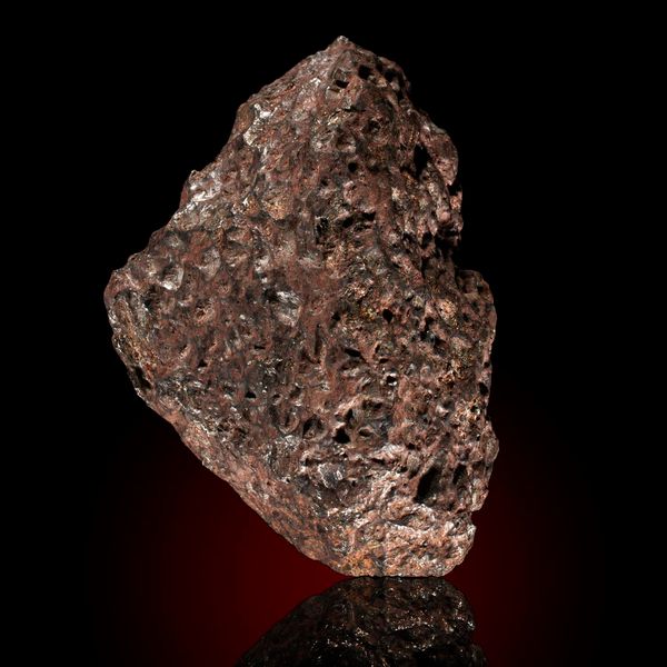 A Pallasite meteorite Brahin fall 18cm by 12cm, 5.1kg This meteorite is a Pallasite Nickel Iron meteorite with 37% Olivine inclusions.  Olivine only...