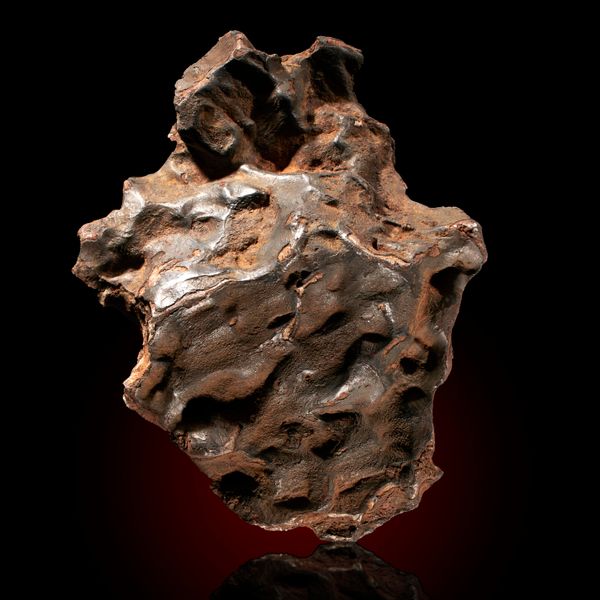 A large Seymchan meteorite  26cm by 15cm, 8.5kg This meteorite was found near the village of this name in the Madagan district of Russia; the fall...