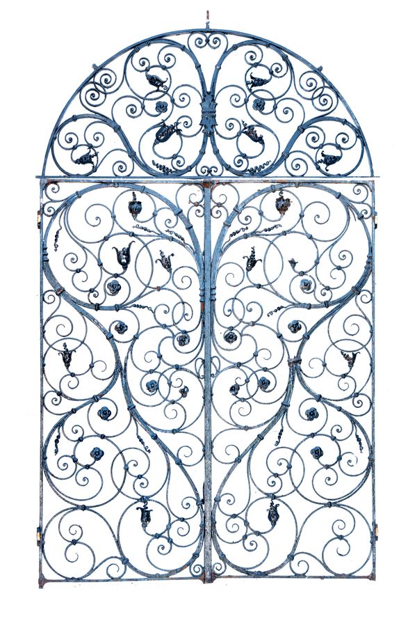A pair of Georgian wrought iron gates 2nd half 18th century with lunette shaped overthrow the gates 213cm high by 174cm wide, the lunette overthrow...