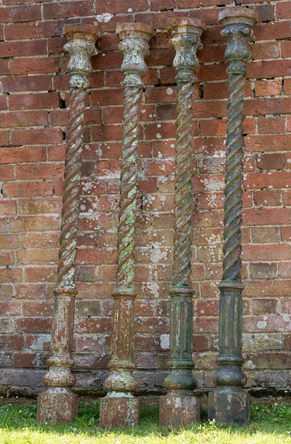 A set of four cast iron uprights  late 19th century  168cm high  