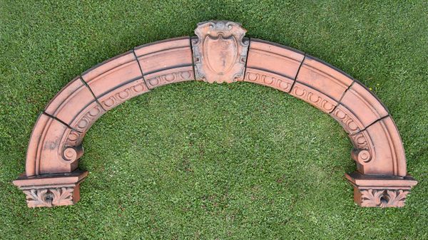 A Victorian terracotta arch  96cm high by external width 197cm,  internal 150cm
