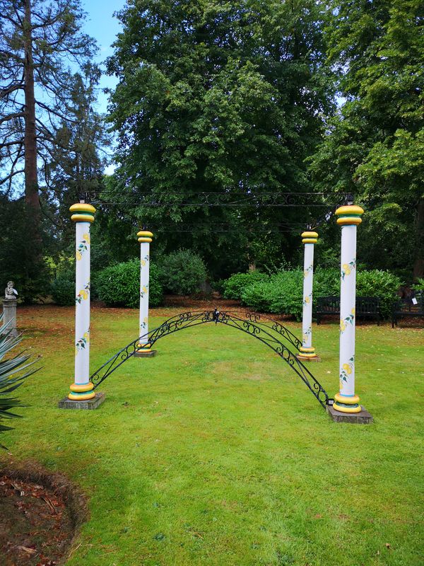 ‡ A majolica and wrought iron pergola modern with maker‘s signature 370cm high by 350cm square Top arch shown on the ground in the centre of the...