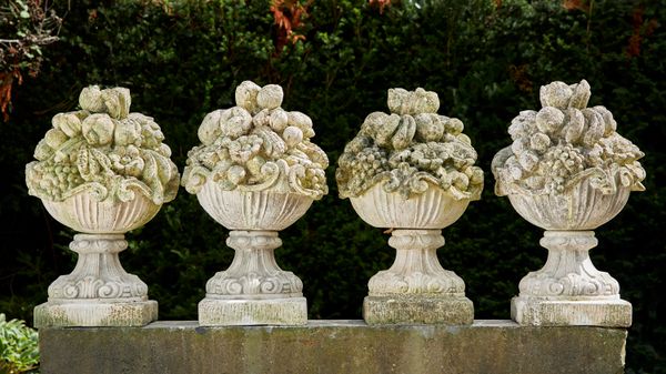 A set of four composition stone baskets of fruit  2nd half 20th century stamped Ital Garden 75cm high