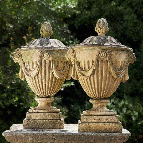 A pair of Coade-style composition stone finials 2nd half 20th century each bearing the stamp Coade, Lambeth 1811 80cm high 