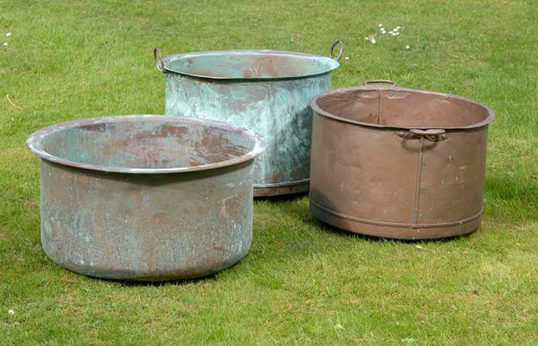 Three washing coppers 19th century including two with handles  the largest 69cm diameter