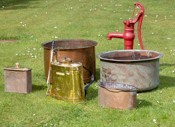 Two washing coppers 19th century  the larger one 72cm diameter, together with some copper and brass vessels, a cast iron garden pump and a sprayer