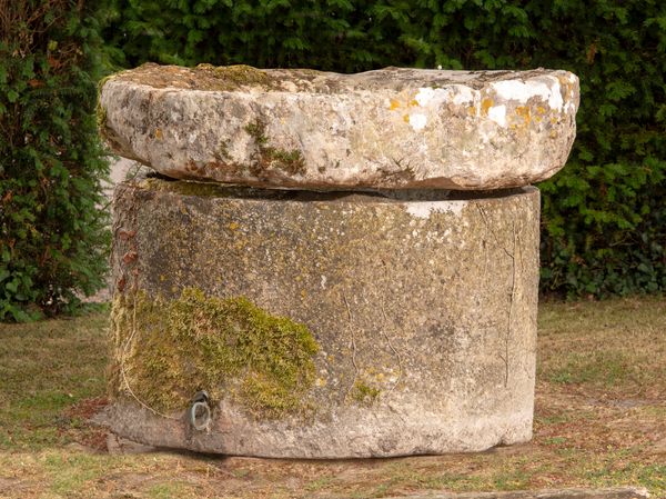 A carved stone wellhead with associated top French, 18th/19th century 68cm high by 110cm diameter 