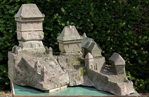 A rare and unusual carved sandstone model of Karlštejn Castle 70cm high by 72cm wide Karlštejn Castle is a large Gothic castle founded in 1348 by...