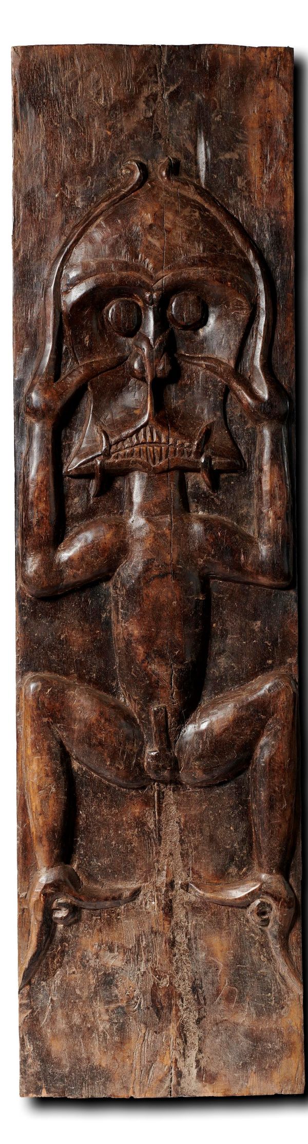 A Carved hardwood tribal panel 1st half 20th century  185cm high by 49cm wide