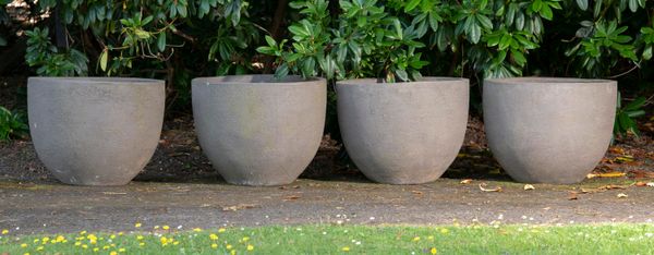 A set of four Atelier Vierkant handmade clay planters modern each with maker‘s stamp 46cm high by 59cm diameter 