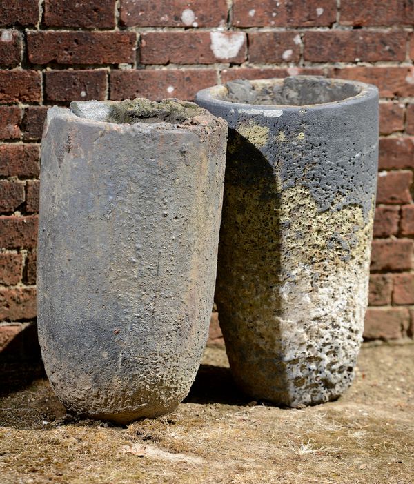 A pair of lava stone smelting pots  late 19th/early 20th century  61cm high