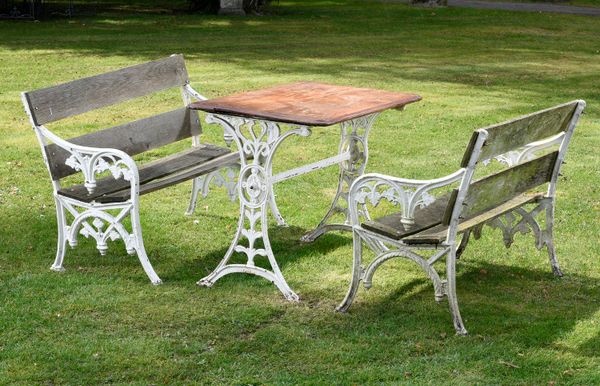 A pair of Falkirk foundry cast iron seats late 19th century 117cm wide, together with a late Victorian cast iron table, with mahogany top, 106cm...