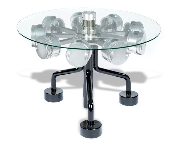 A circular topped table incorporating 1930‘s aircraft pistons the central boss engraved Wright Aircraft Engines 102cm diameter