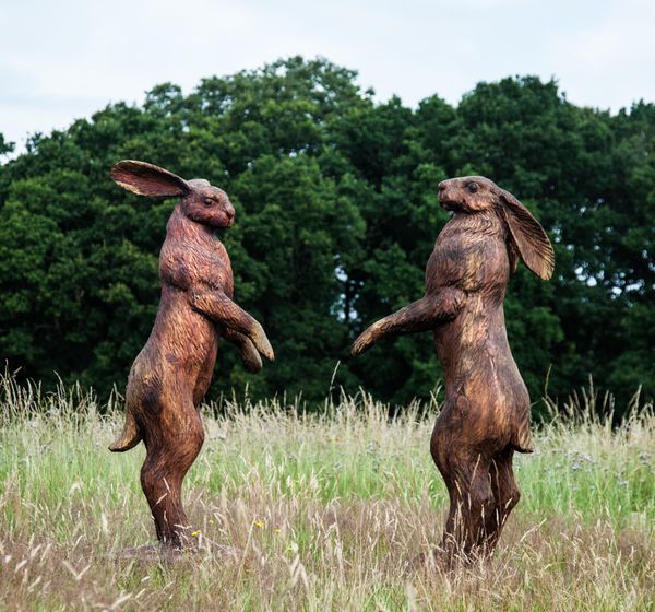 Ant Beetlestone Boxing hares  Carved wood Unique each approx 186cm high by 66cm wide by 80cm deep  Ant spent seven years at art school, including 2...
