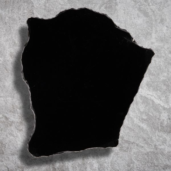 A large obsidian tabletop Mexico 82cm