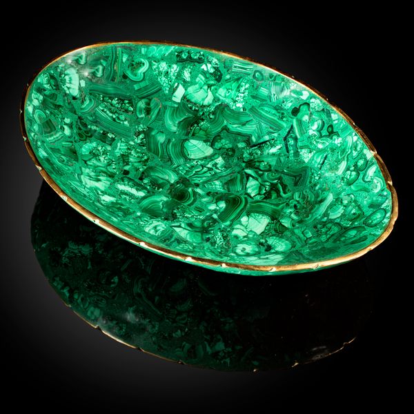 A large malachite bowl 38cm wide, together with four smaller malachite bowls, 17cm wide