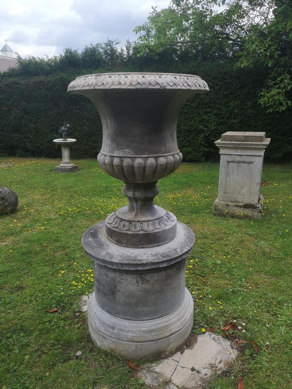 A composition stone urn on pedestal 156cm high
