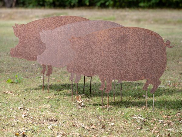 A set of three sheet iron pigs modern 90cm long