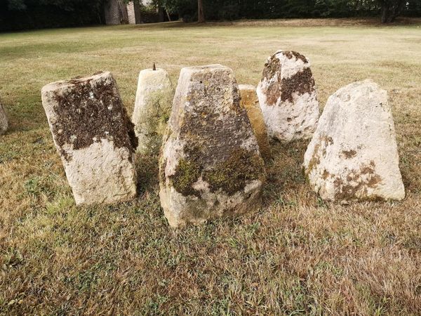 A set of six carved staddlestone bases
