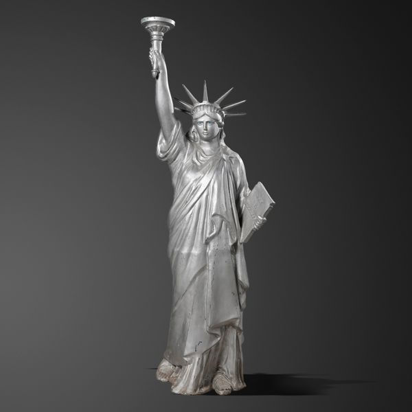 After Frédéric Auguste Bartholdi: A metal alloy figure of the statue of Liberty 20th century holding a table inscribed July 4th 1875 in roman...
