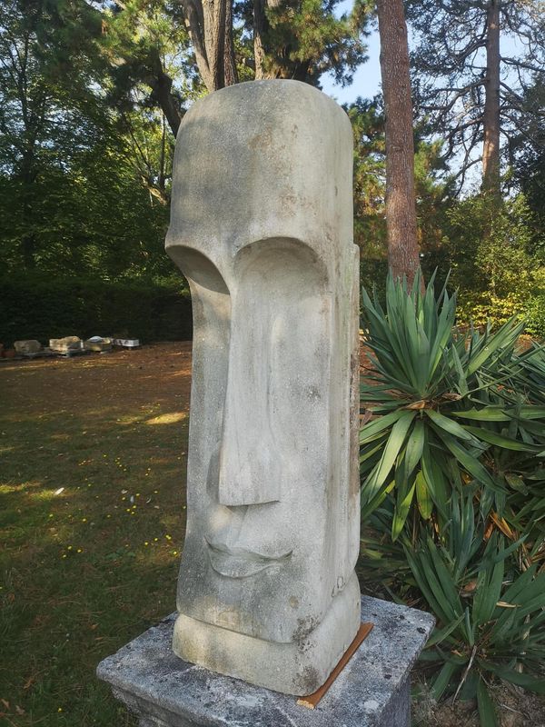 A composition stone stylised head 2nd half 20th century  100cm high