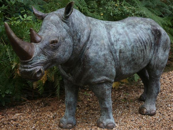 John Cox, Born 1941 White rhinoceros  Bronze  154cm high by 70cm wide by 270cm deep