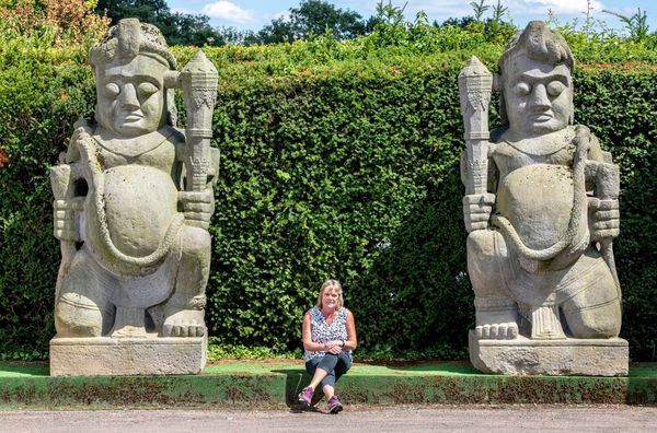 A pair of monumental and impressive carved stone temple guardians (Dvarapala) Balinese, last quarter 20th century 320cm high by 130cm wide by 112cm...