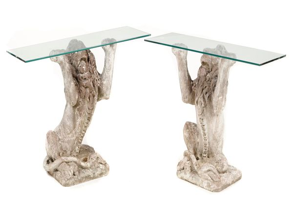 A pair of unusual composition stone seated lion console tables 2nd half 20th century with rectangular glass tops 115cm wide
