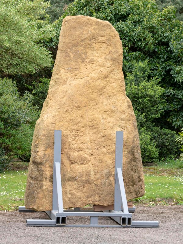 An unusual Cotswold stone henge in iron stand 260cm high overall by 140cm wide