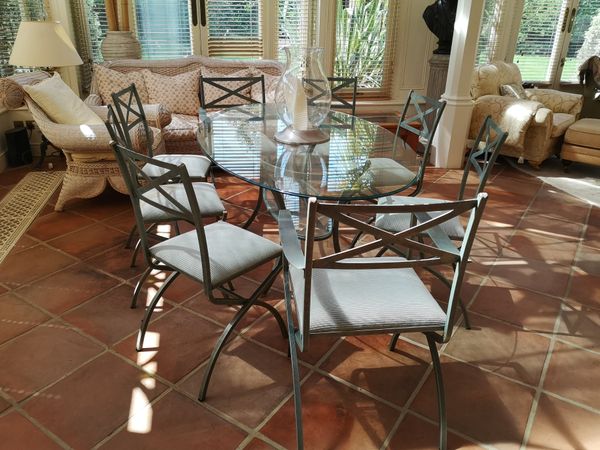 A suite of painted metal dining room  furniture