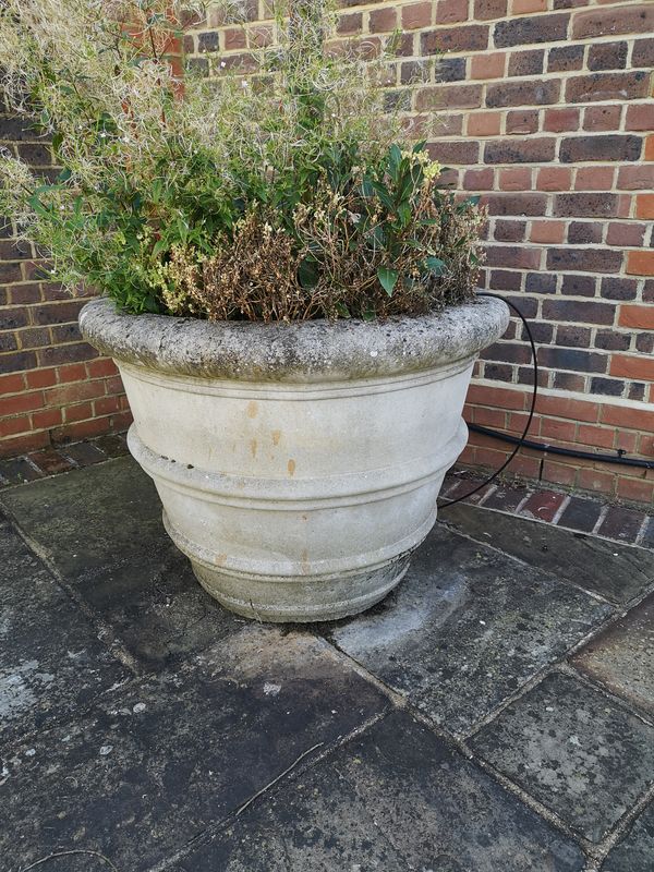 A pair of substantial composition stone tapering cylindrical planters