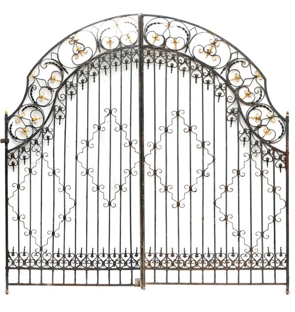 † A pair of wrought iron gates early 20th century  334cm high by 348cm wide 