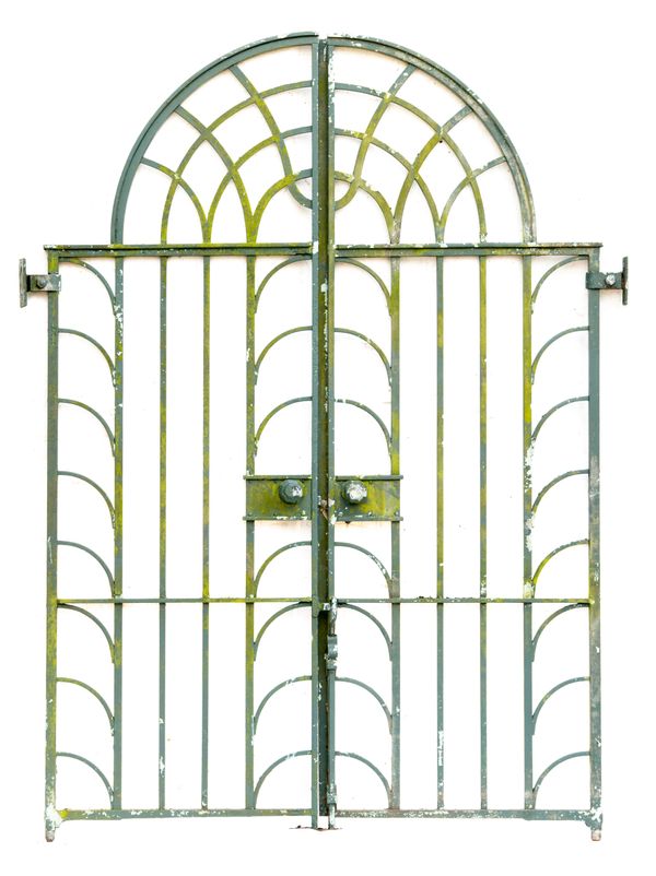 A pair of wrought iron gates 2nd half 20th century together with cast iron uprights the gates 246cm high by 170cm total width; the uprights 296cm...