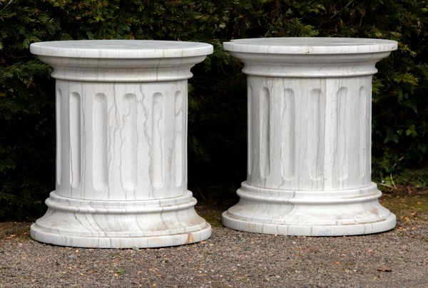 A pair of veined white marble pedestals modern 59cm high