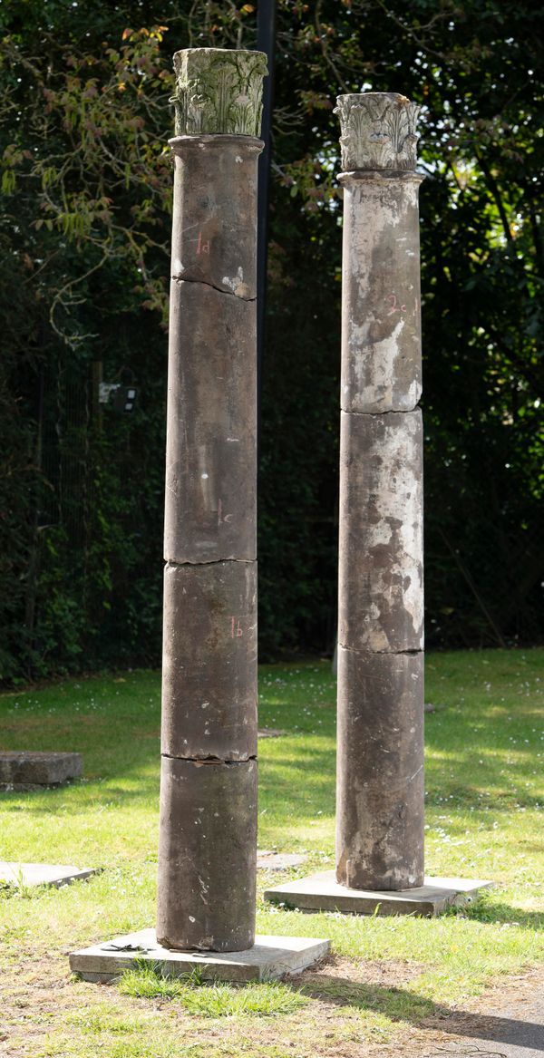 A pair of carved sandstone columns late 17th/18th century with acanthus carved capitals 260cm high 