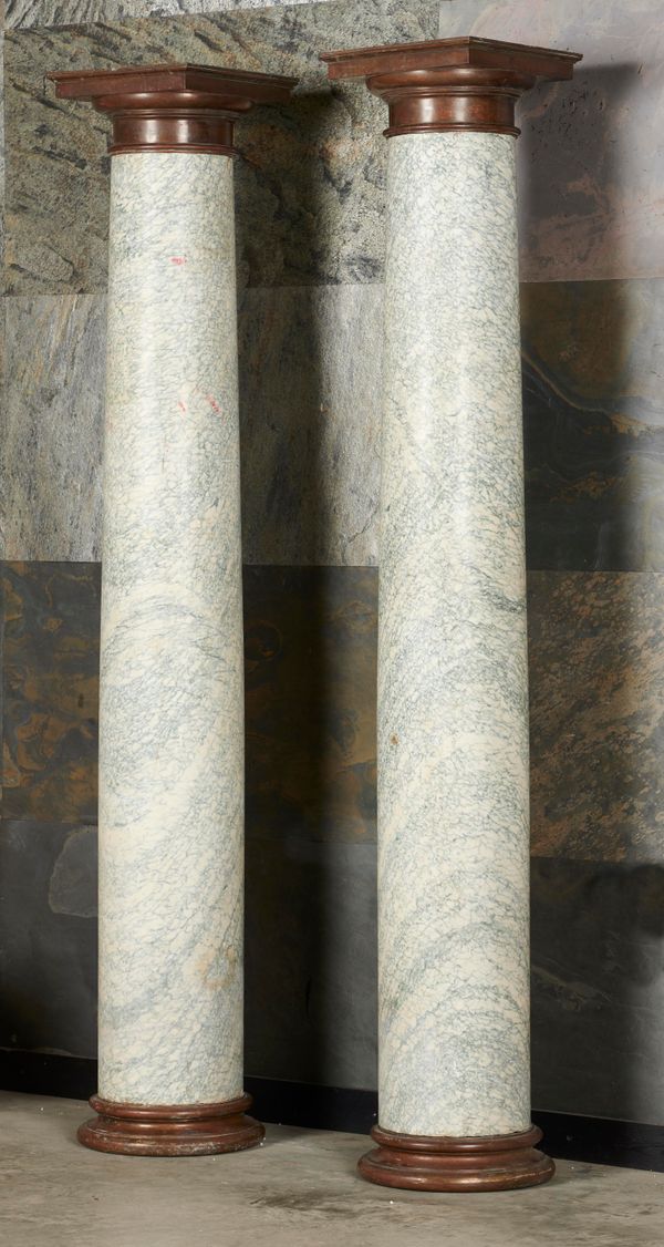 A pair of Cipollino marble columns 19th century with bronze caps and bases 216cm high by 38cm diameter   