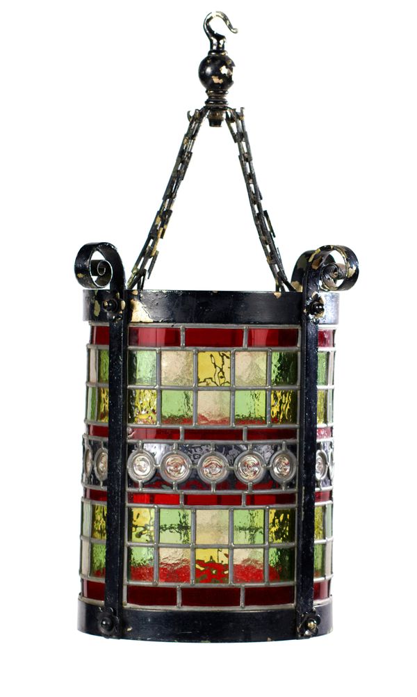 A cylindrical painted bronze hanging lantern  late 19th century  with stained glass panels 38cm high 