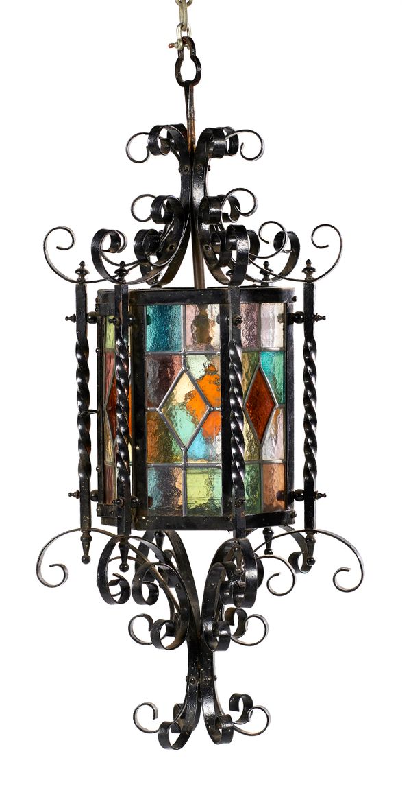 Two wrought iron hexagonal glazed lanterns  early 20th century the larger 78cm high