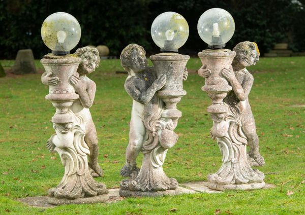 A set of three composition stone standing lamps Italian, 2nd half 20th century 103cm high 