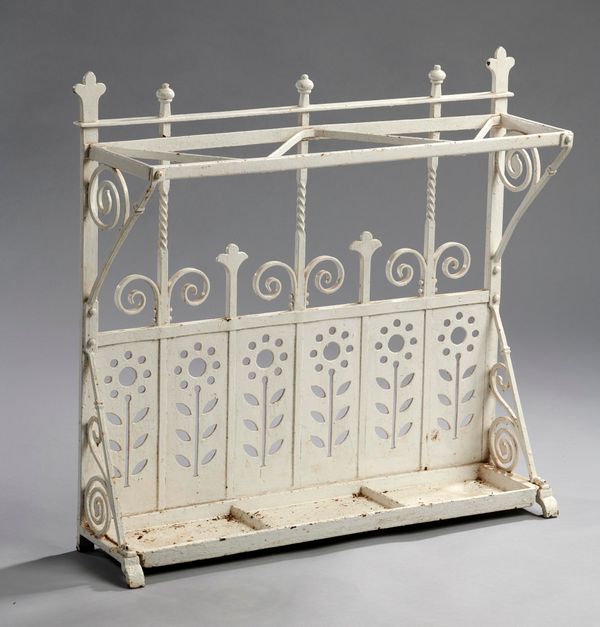 An unusual wrought iron stick stand late 19th century with lift out drip tray 82cm wide
