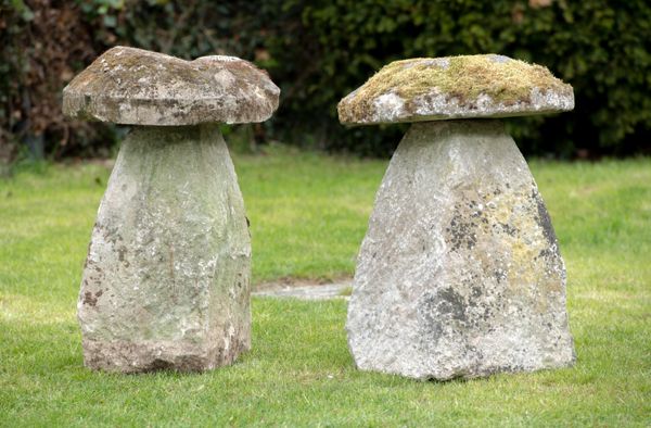 Two carved staddlestones 73cm high