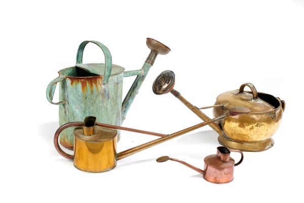 A copper watering can English, 19th century with associated rose 64cm long, together with two other brass watering cans, French or Dutch, 19th...